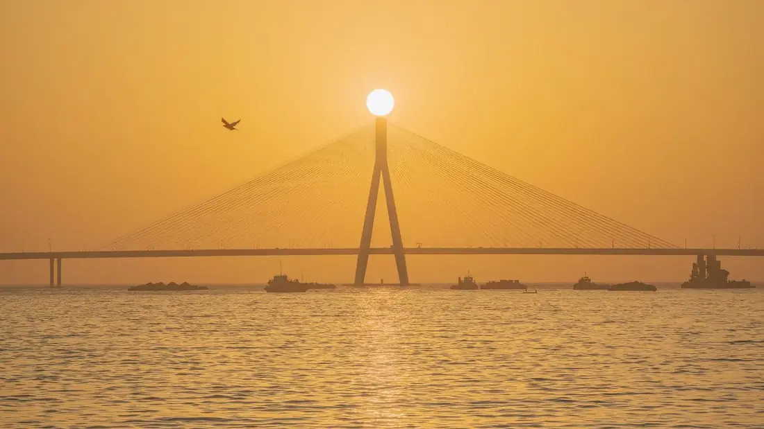 The Bandra-Worli Sea Link at sunrise, seen across the water